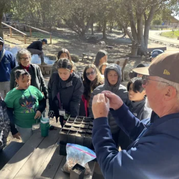 Franciscan Brother James Lockman, a restoration botanist, explains the wonder of trees during sixth-grade camp.