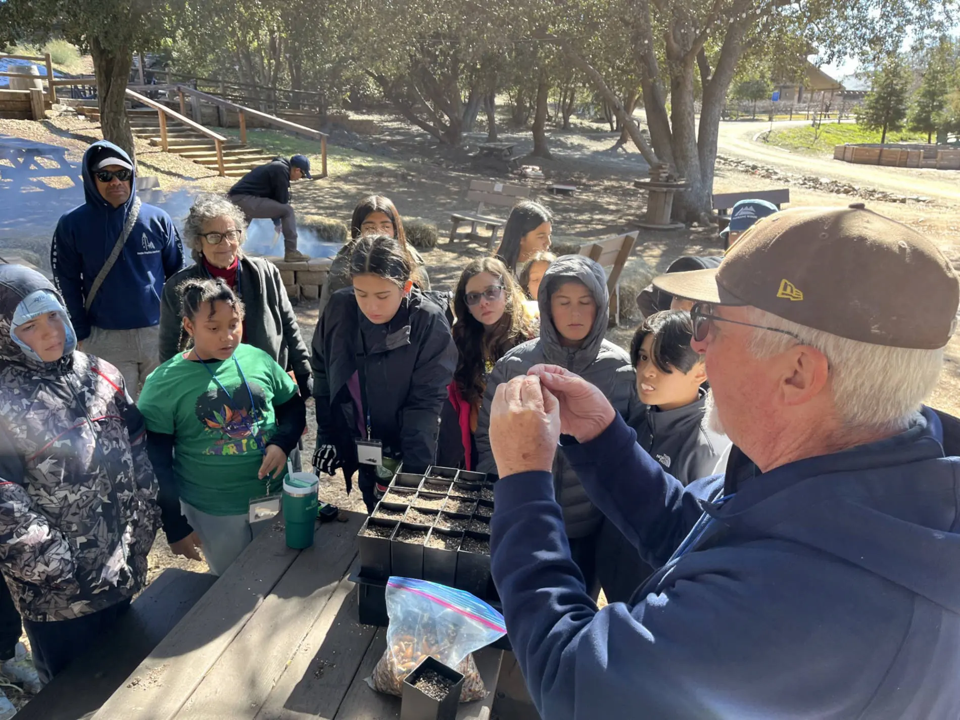 Franciscan Brother James Lockman, a restoration botanist, explains the wonder of trees during sixth-grade camp.